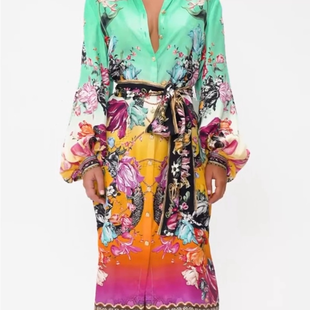 Camilla button down dress with belt tie fits a medium. These dresses run small.